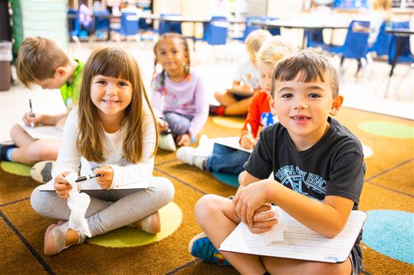 Students inside their classrooms learning. 